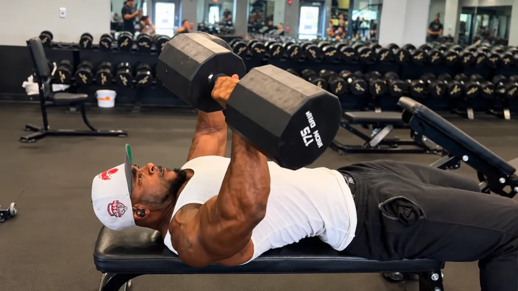 Anthony Gilkes doing a dumbbell bench press
