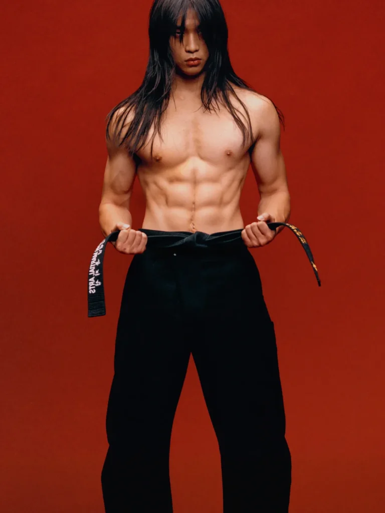 Caleb So holding a black belt